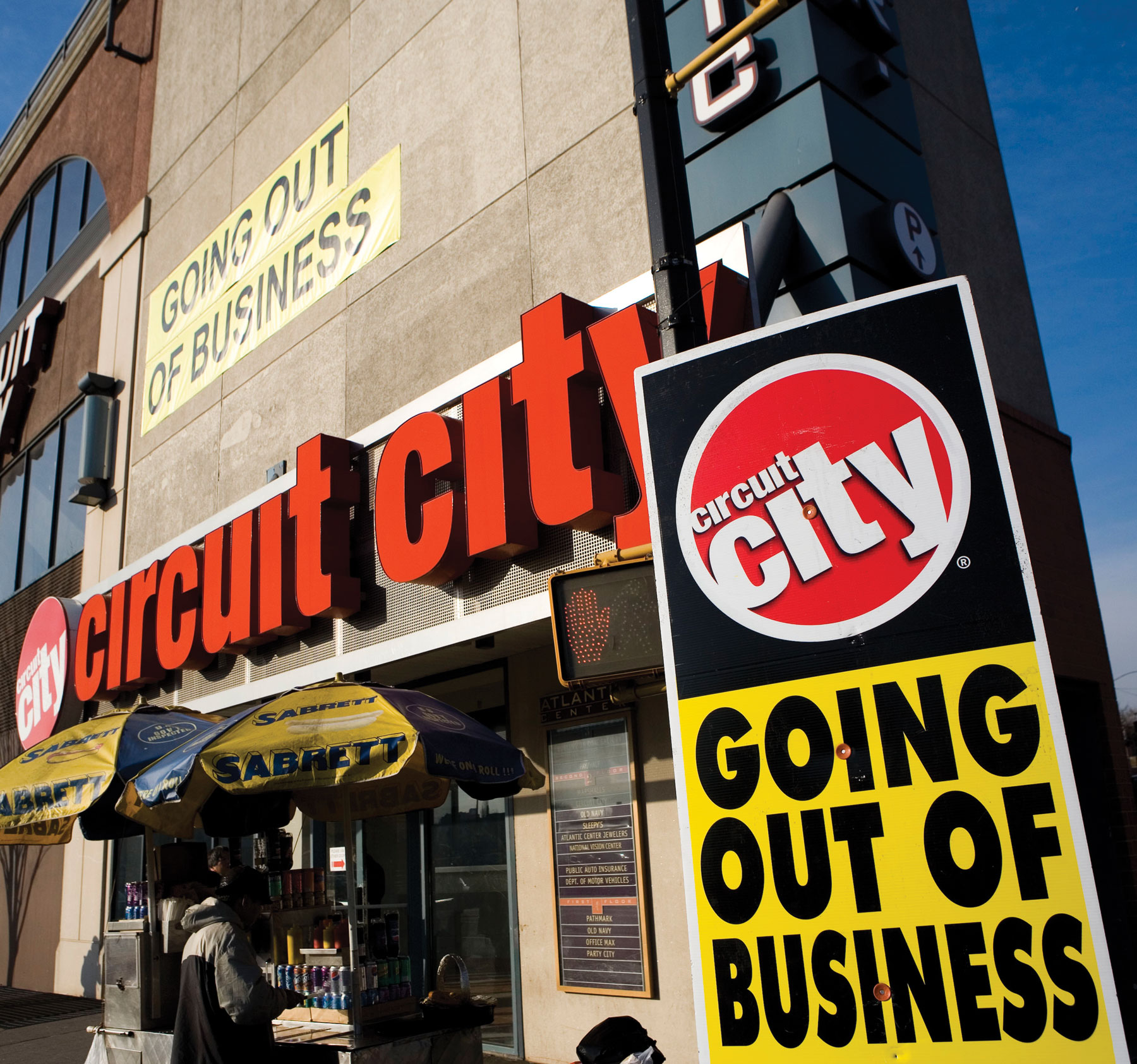 Photo shows a billboard outside a shop which reads “Circuit city: Going out of business”.