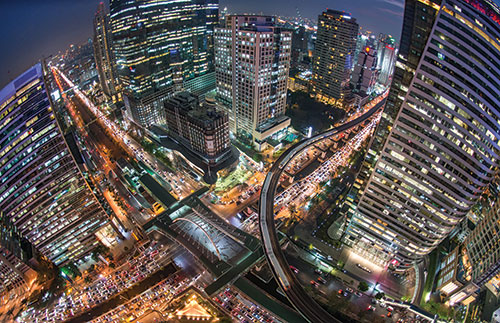 Bird’s eye view of a bustling city in the night.