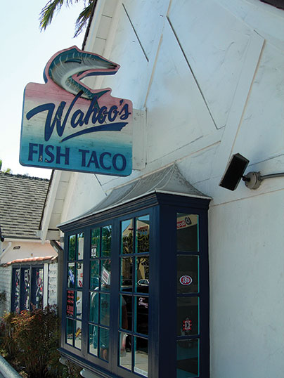 Photo shows the sign ‘Wahoo’s Fish Taco‘.