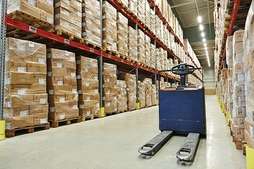 Photo shows a warehouse stocked with parcels.