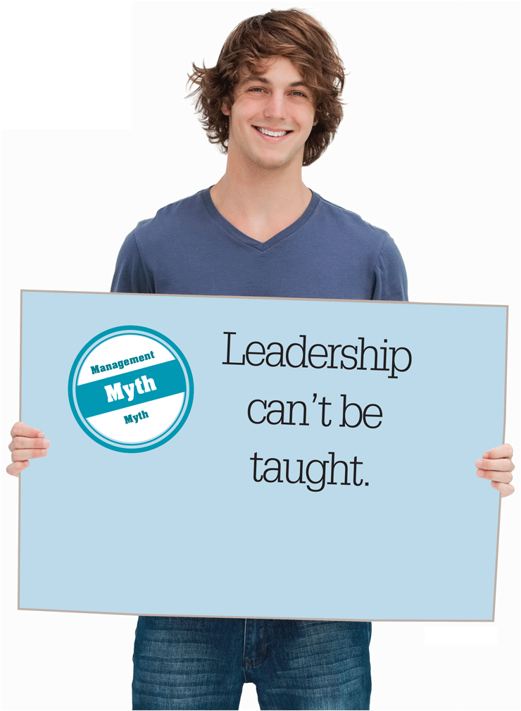 A photo shows a person holding up a board with the words, Leadership can’t be taught.