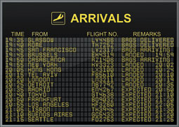 A screen shows airport flight arrival times.