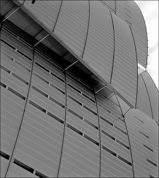 An aerial view of the architecture of a futuristic modern design structure.