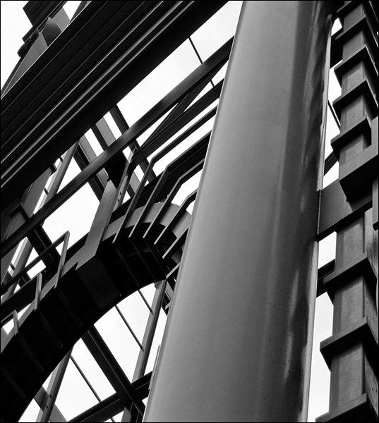 An aerial view of the construction of a building designed with steel pillars and construction materials.