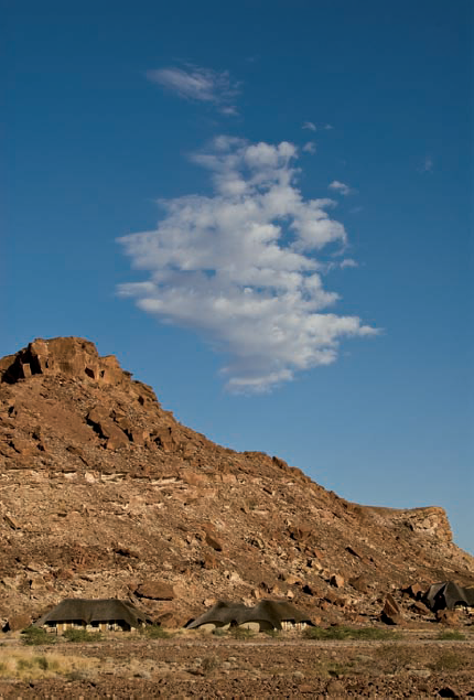 ABOUT THIS PHOTO A single cloud punctuated a blue sky, which created an interesting color composition of the Twyfelfontein Lodge in Damaraland, Namibia. Taken at ISO 100, f/16, 1/180 sec. with a Nikkor 24–70mm lens.