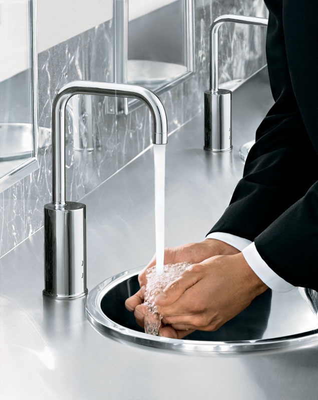 The Tripoint Gooseneck Touchless Electronic Faucet releases water when hands are placed inside the sink. Courtesy Kohler.