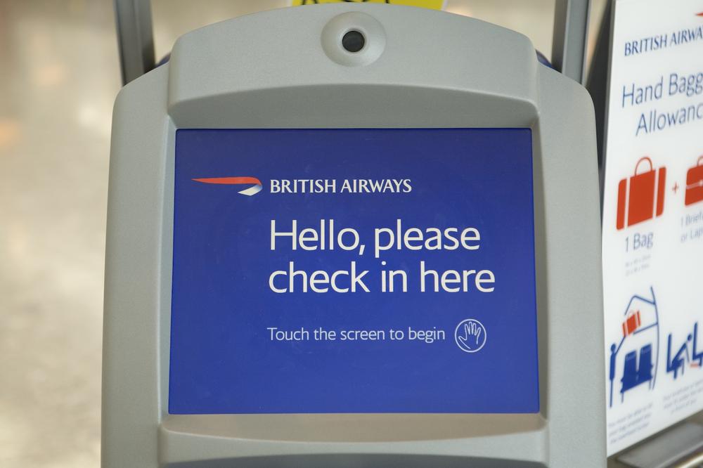 Politeness in the messaging, combined with a small hand icon on the British Airways kiosk at Heathrow Airport. Courtesy Terminal5Insider.