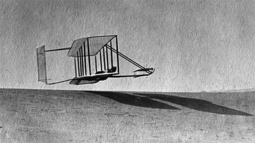 An early Wright brothers' glider on a test run at the famed Kill Devil Hills.