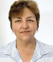 A professional headshot of Dr. Annelize Botes, captured against a white backdrop.