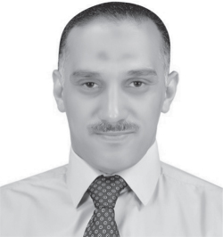 A portrait view of Ali Ismail Awad. He wears a formal shirt with a tie.