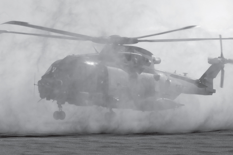 Photo of a Merlin Mk 3 in the desert creating its own DVE.