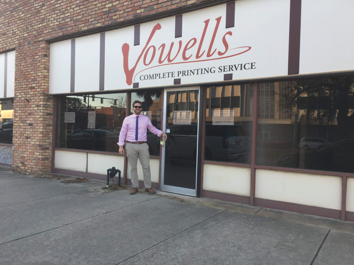 Photograph of a man in front of an old printing shop, which was to be turned into a craft brewery shortly.