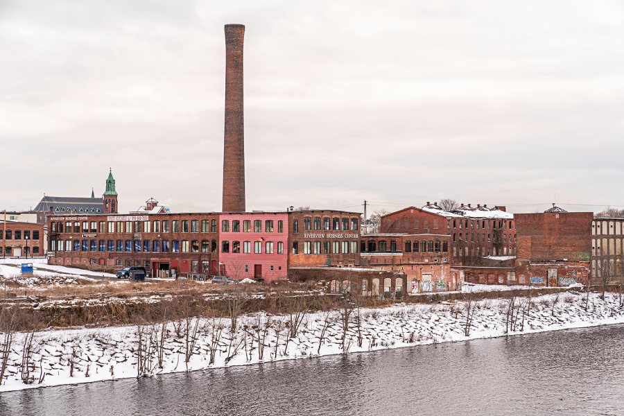 Photograph of the old factories of Lawrence, Massachusetts, sit on the Merrimack River.