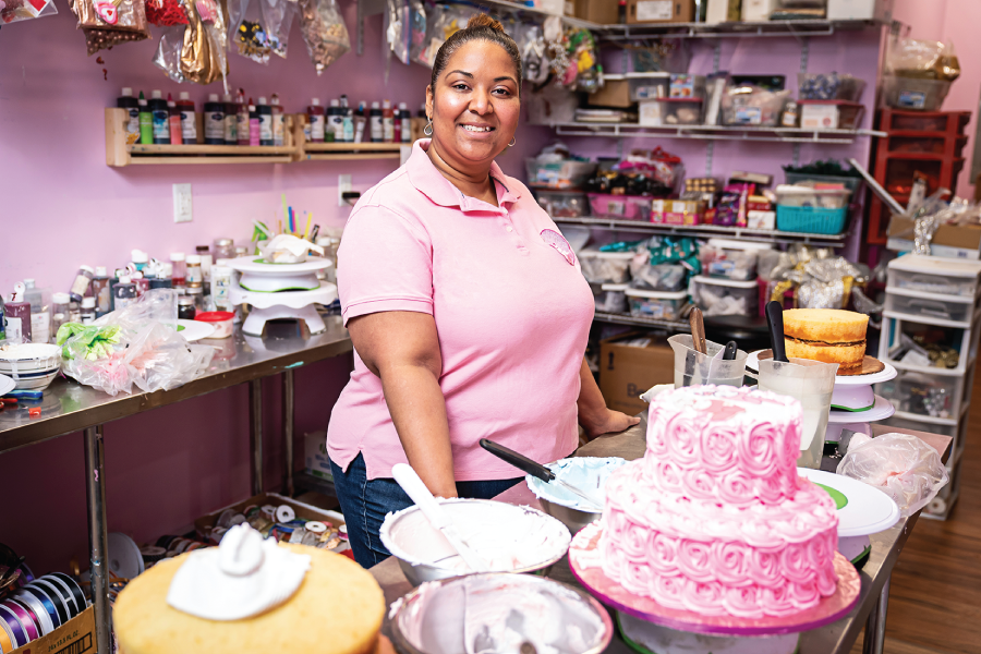 Photograph of Danaris Mazara, surrounded by her work.