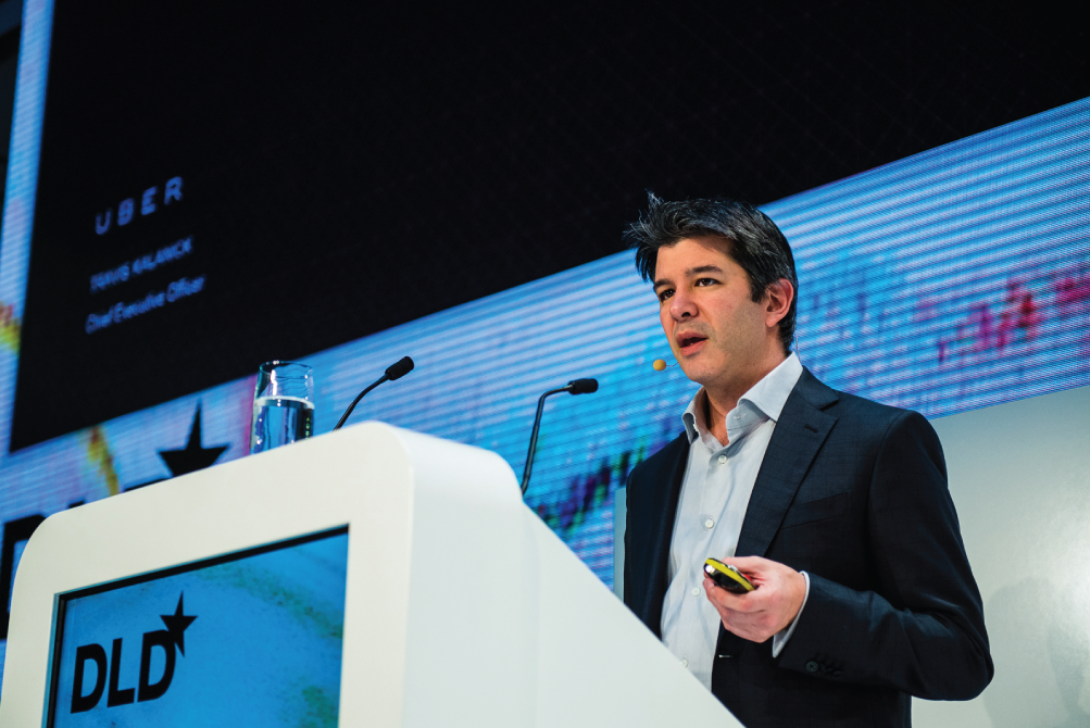 Photograph of Travis Kalanick speaking at a conference in Germany in 2015. 