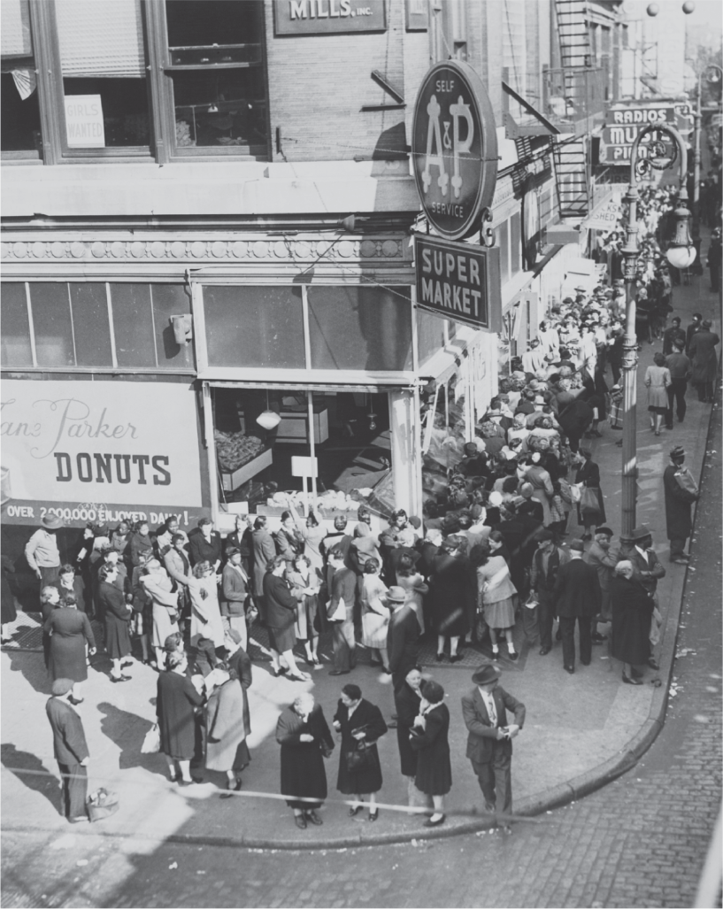 Photograph shows an early A&P supermarket opening in New York City in 1939. 