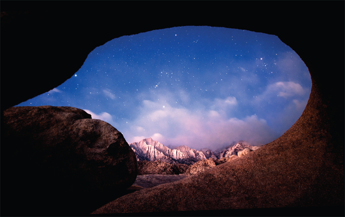 23.1 The constellation Orion poised over the Eastern Sierra in the early morning twilight and peeking through the portal of the Möbius Arch. There are only a few days out of the entire year when this image is possible. The following conditions need to be simultaneously satisfied: (i) Orion is positioned at this precise altitude and azimuth; (ii) at this point within the period of pre-dawn astronomical twilight; and (iii) with the moon below the horizon. A few minutes later, Orion is obscured by the bright sky; a few minutes earlier and it is overwhelmed by the abundance of stars. Furthermore, Orion is not properly positioned through the arch at this same time a month earlier or later. Finally, this image can only be created within a few days of the new moon, otherwise the moonlight sky is too bright. Clearly, thorough planning is needed to ensure success!