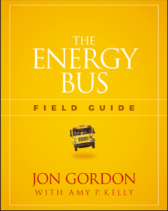 A cover page of a book. A title text that reads in upper case, The Energy Bus. Below the title is a text that reads in uppercase, Field guide. An image of a bus and the text at the bottom of the cover page reads, in upper case, Jon Gordon.