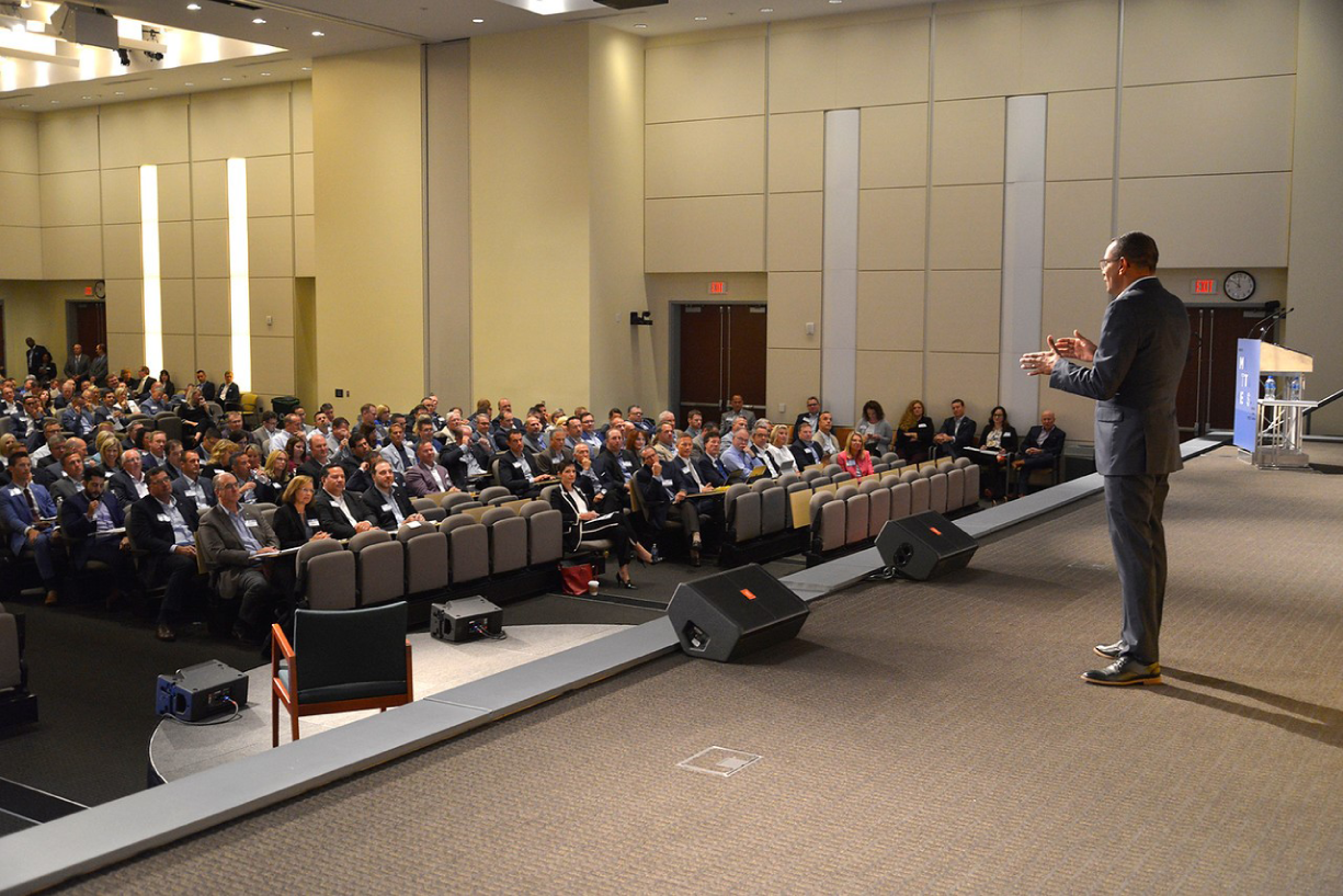 Photograph of Mindful Leadership: Walking the Talk. Speaking at a conference in St. Louis to 350 regional leaders and financial advisors.