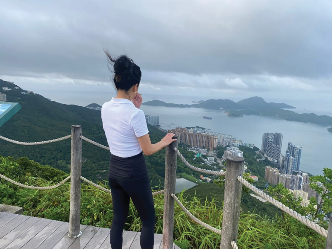 A photograph depicts a woman gazing out at the world.