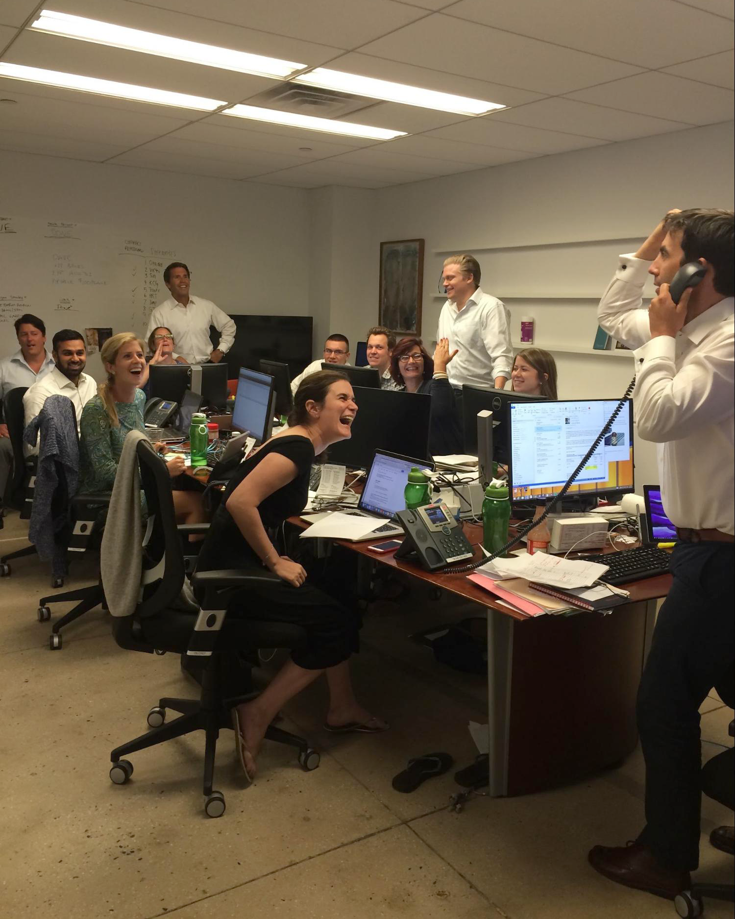 David Rutter, standing up on the left; Jesse Edwards, standing up in the middle; and Todd McDonald, on the phone on the right. The office was tiny, but motivation was high.