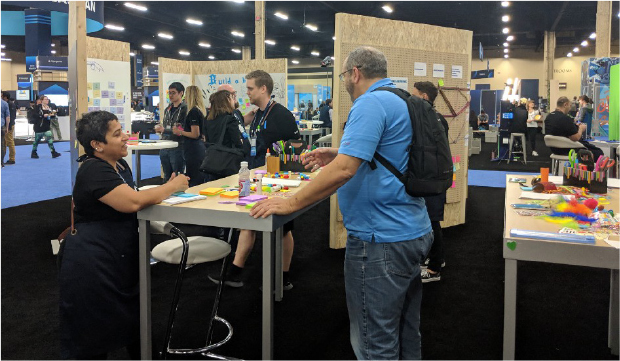 Atlassian researchers working with users in a conference (source: https://oreil.ly/oBAo2)