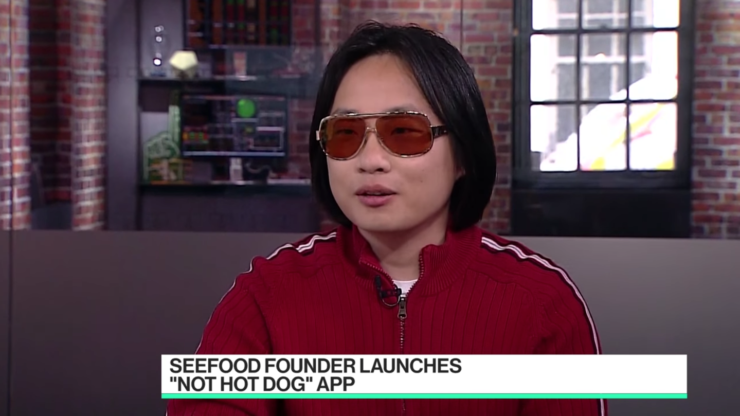 Jian Yang being interviewed by Bloomberg News after Periscope acquires his “Not Hotdog” technology (source: HBO’s Silicon Valley)